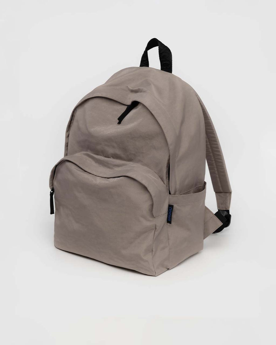 large taupe nylon backpack with two front zipper compartments and drink holder on the side