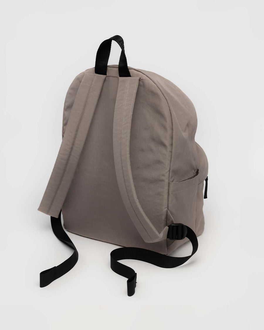 back view of large taupe nylon backpack with two front zipper compartments and drink holder on the side