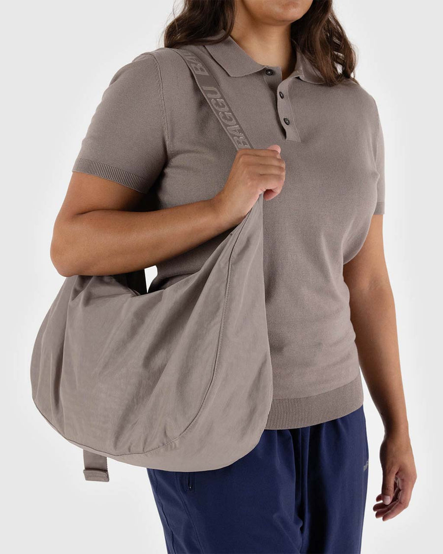 model carrying taupe nylon large crescent bag