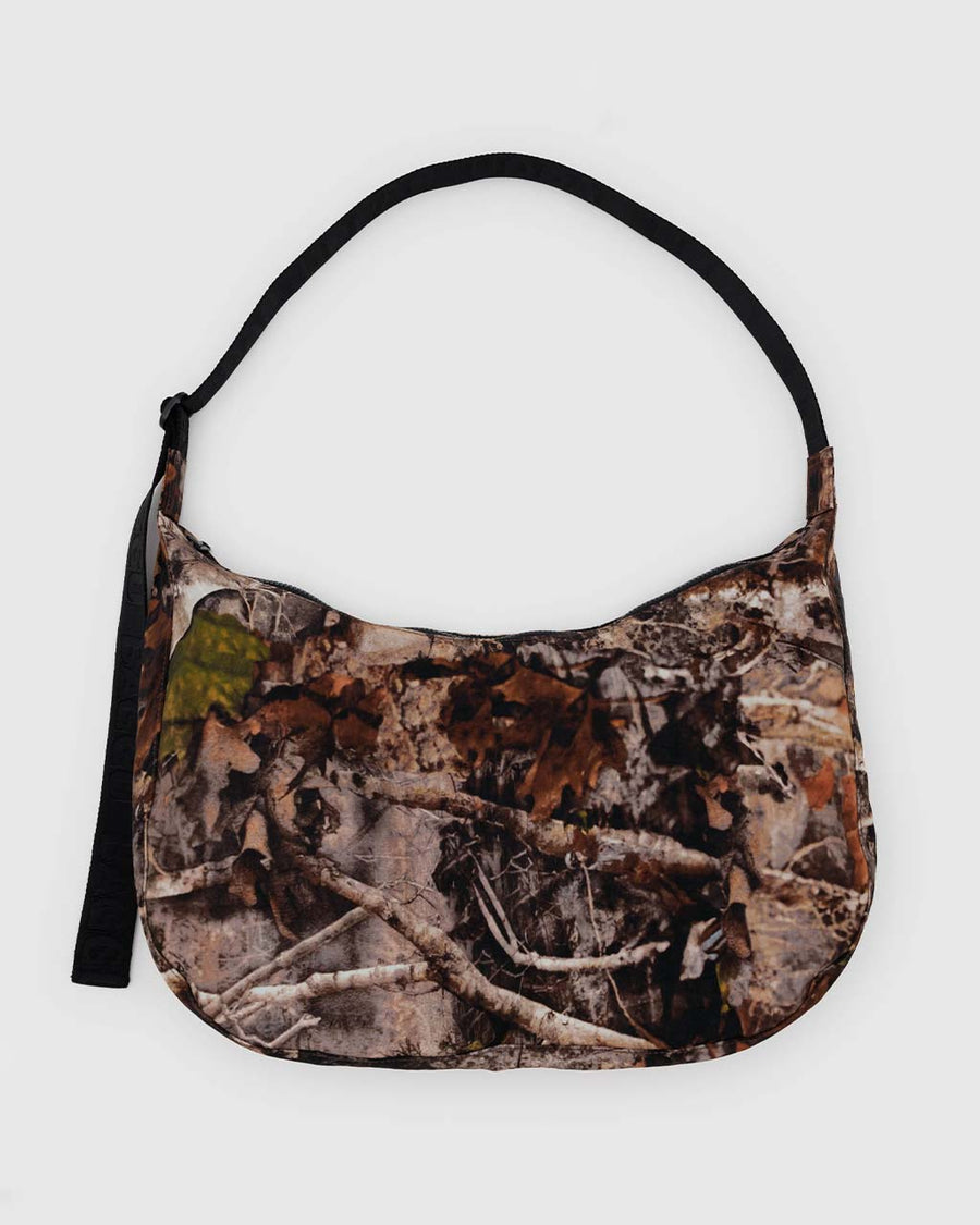 large nylon crescent bag with brown realistic forest print