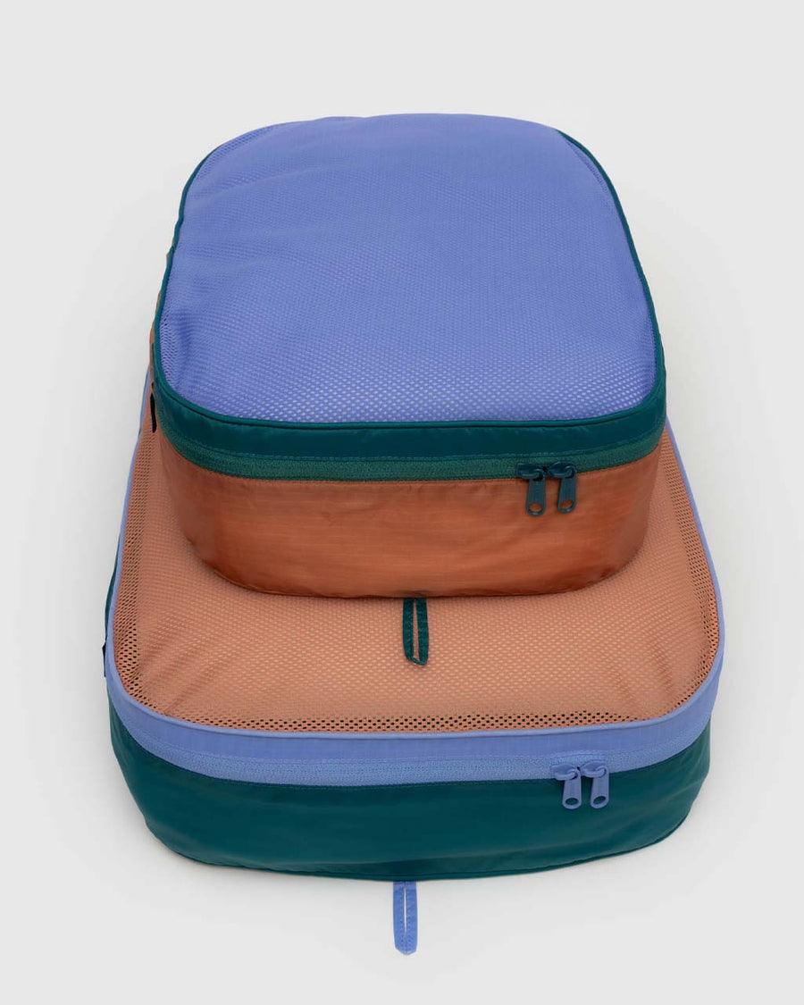 set of two large packing cubes: cornflower, terracotta, and dark green color block