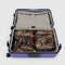 set of two large packing cube set with realistic forest print and cornflower trim zipper in a suitcase