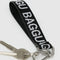 black baggu keychain with white 'baggu' font with keys attached