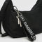 black baggu keychain with white 'baggu' font on a purse