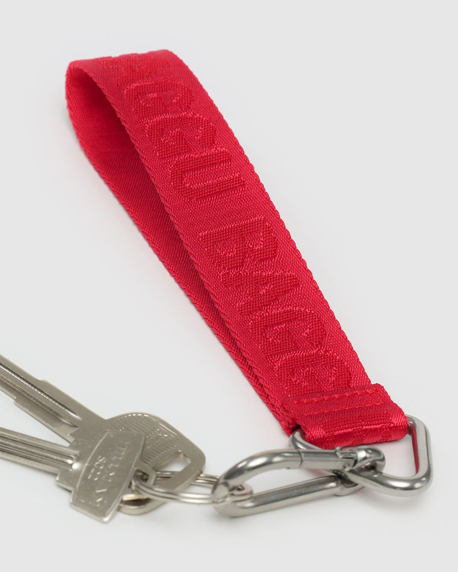 red keychain with red 'baggu' on keys