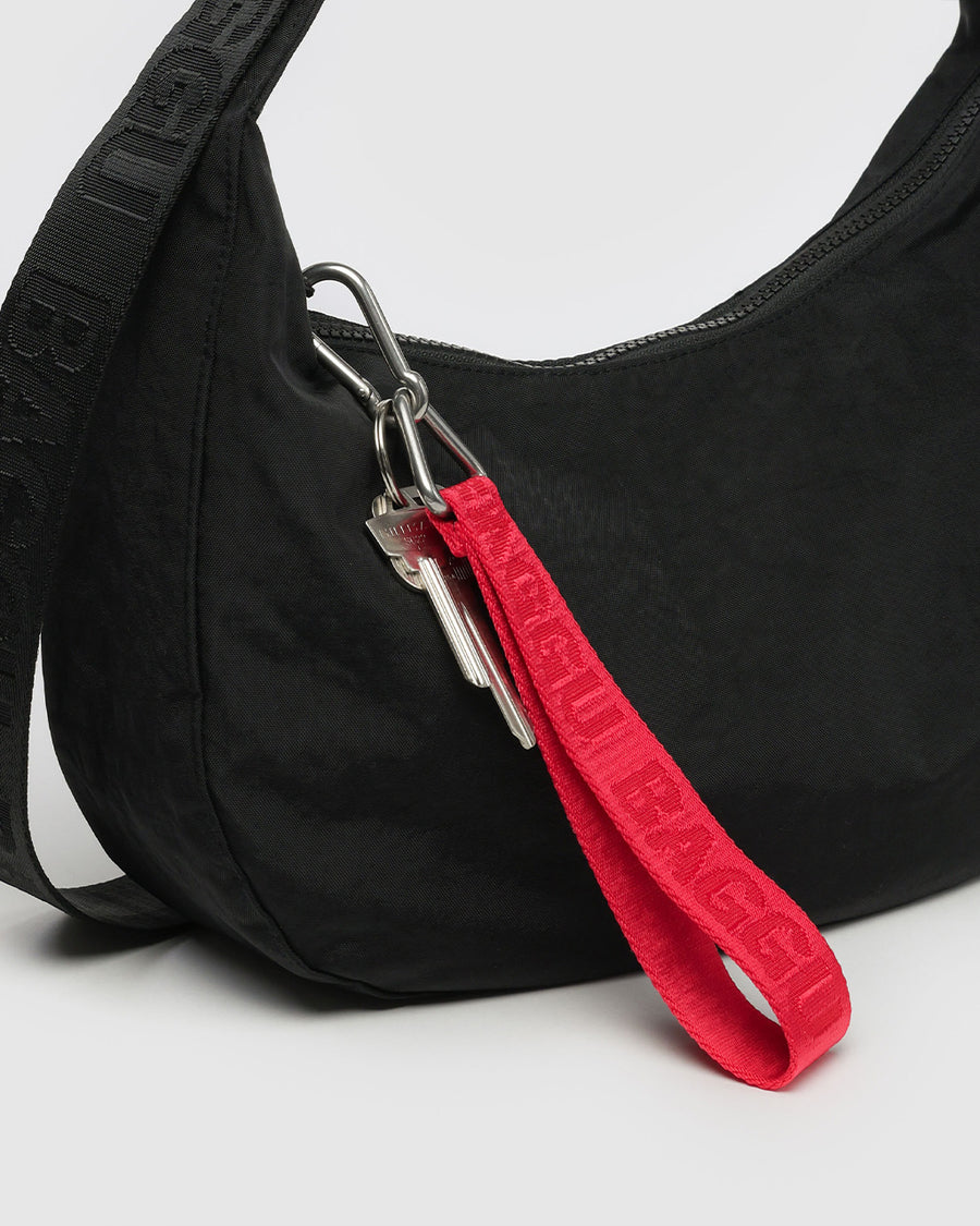 red keychain with red 'baggu' on purse