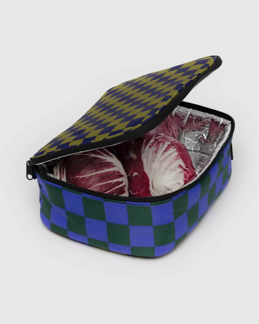 lunch box with olive/navy checker and dark green and bright blue checker with black trim with veggies inside