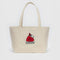 medium heavyweight canvas tote with snoopy in a red puffer jacket and embroidered 'snoopy'