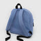 back view of cornflower medium nylon backpack with large zipper compartment, front zipper pocket, and side drink holder