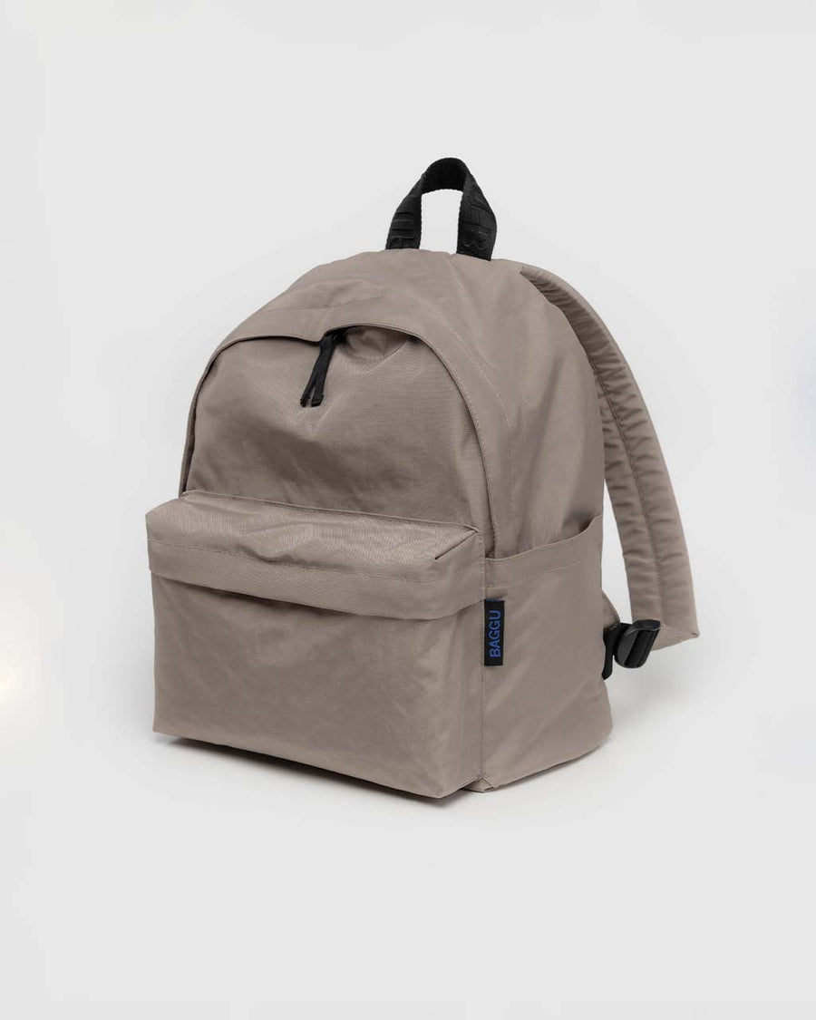 taupe medium nylon backpack with large zipper compartment, front zipper pocket, and side drink holder