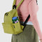 model wearing lime green medium nylon backpack