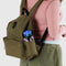 model carrying dark green medium size nylon backpack