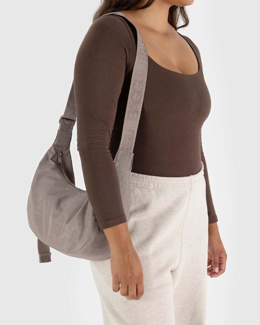 model carrying taupe medium nylon crescent bag with tonal strap