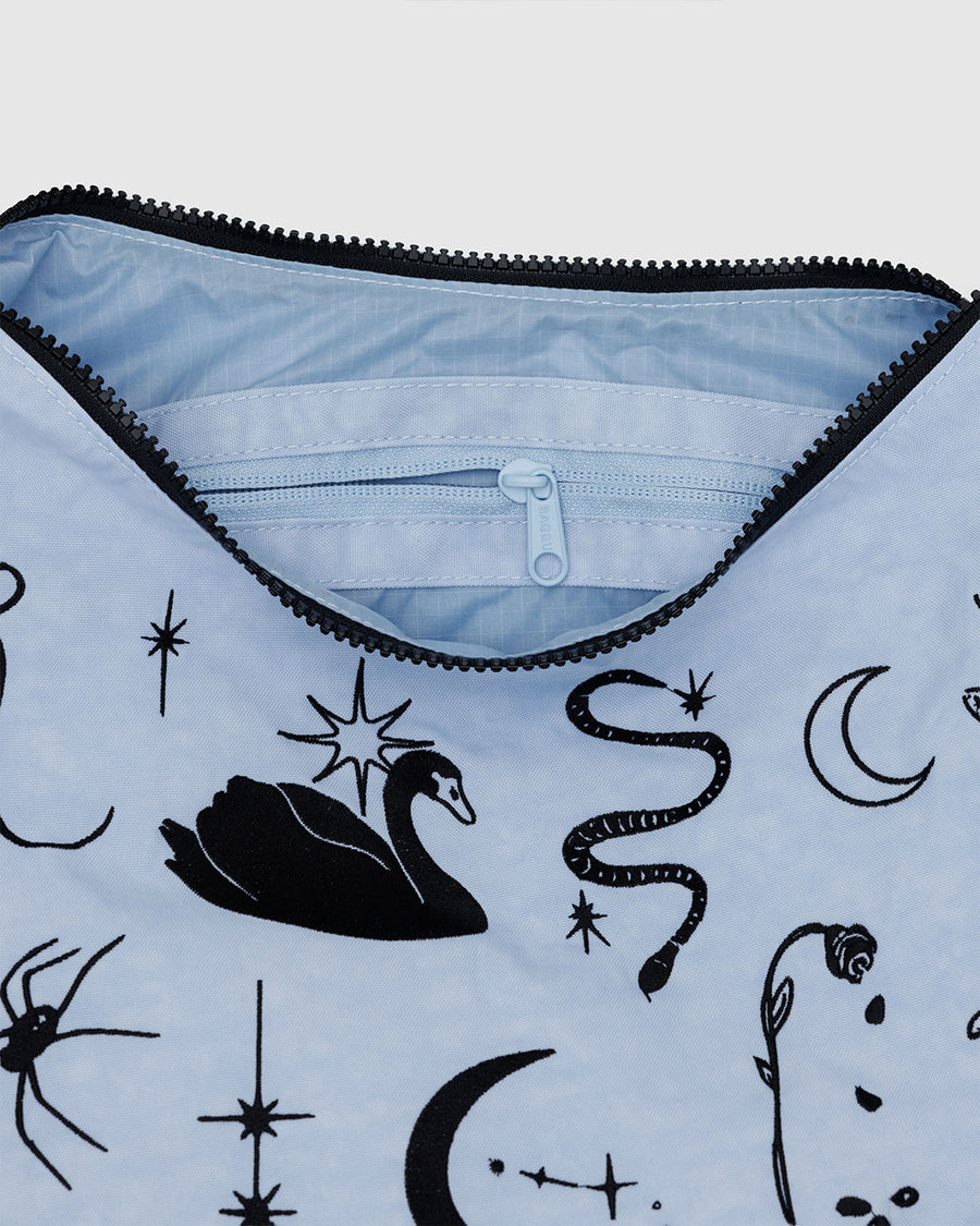 up close of light blue medium crescent bag with black embroidered ballet icons 