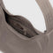 interior pocket of taupe mini nylon shoulder bag