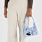 model holding light blue mini shoulder bag with black embroidered ballet icons