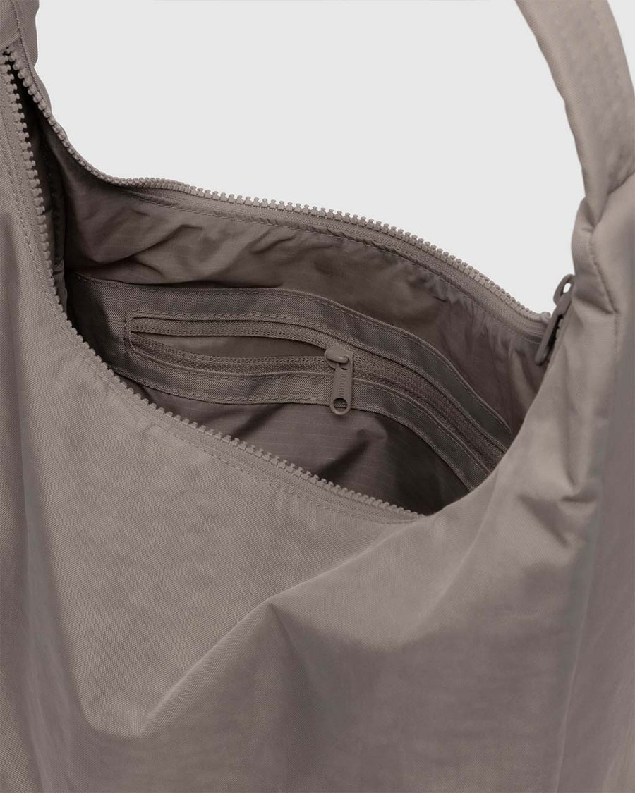 interior pocket of taupe nylon shoulder bag