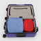 set of two nylon packing cube set: red small and cornflower large in a suitcase