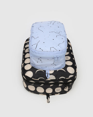 set of 2 packing cubes: light blue constellation, and black with cream moon phases