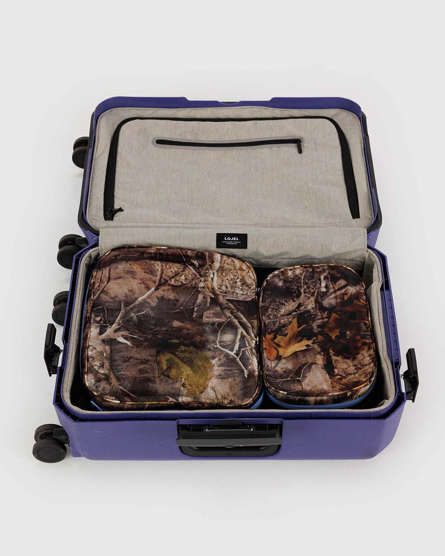 set of two packing set with photo forest print and cornflower trim zipper in a suitcase