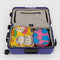 set of two packing set with pink abstract fruit print and yellow abstract pastries print in a suitcase