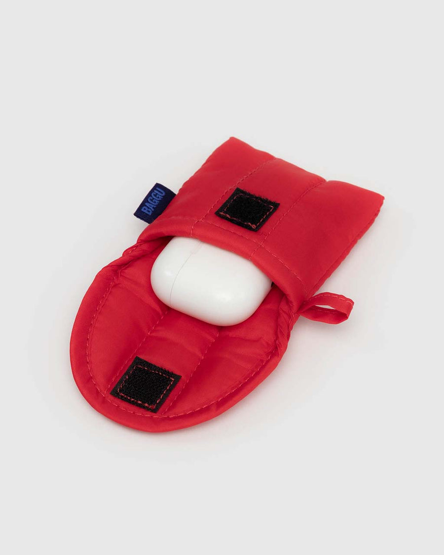 candy red puffy earbuds case with earbuds peeking out