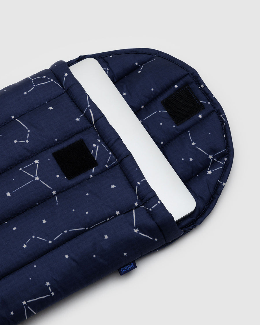 navy 13 in. puffy laptop sleeve with white constellation print with laptop inside