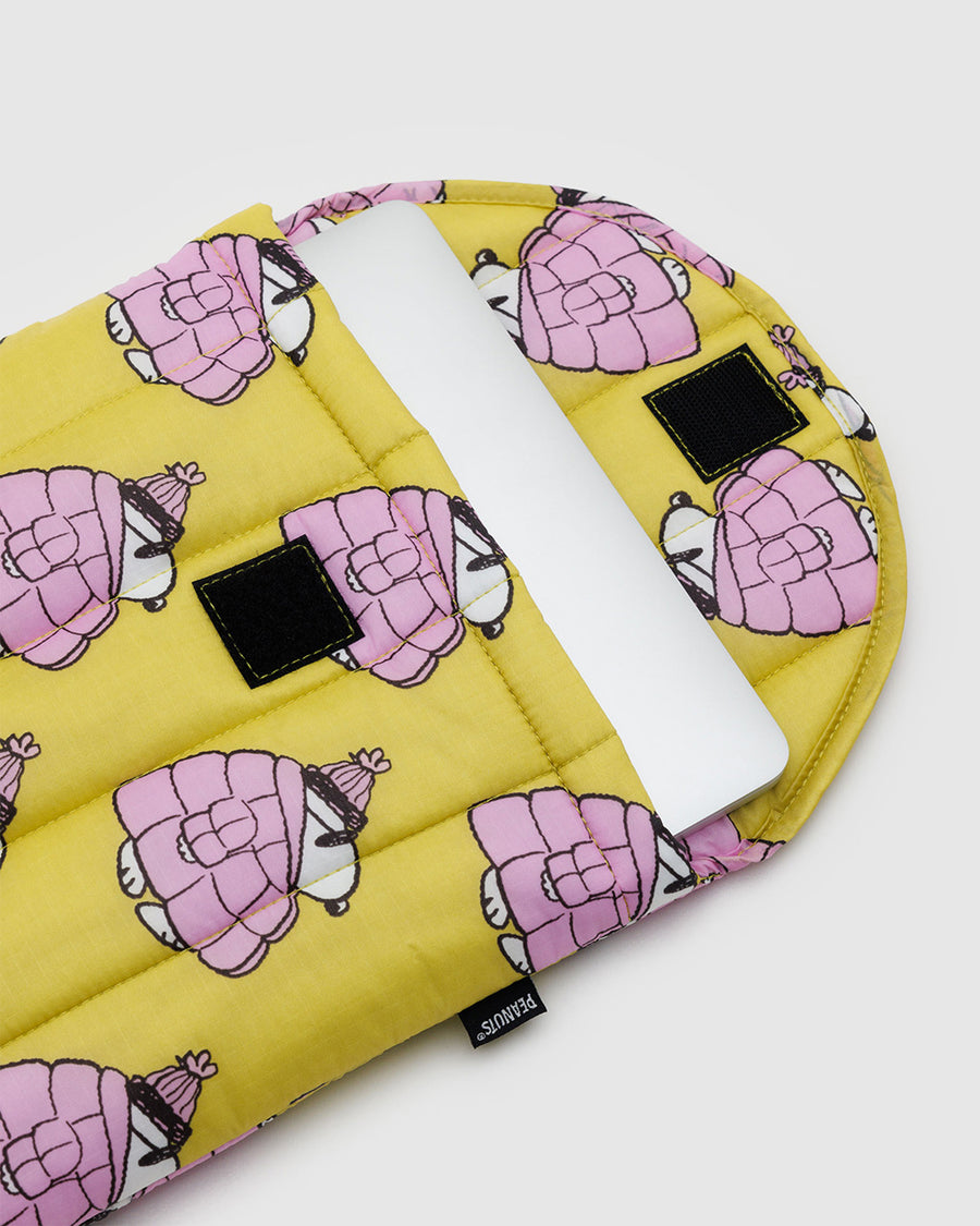 yellow 13 in. puffy laptop sleeve with snoopy in a pink puffer coat with laptop inside