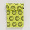 yellow 13" puffy laptop sleeve with black all over smiley face print