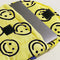 opened yellow 13" puffy laptop sleeve with black all over smiley face print