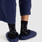 back view of navy blue puffer slippers with white constellation print