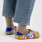 back view of cornflower puffer slippers with snoopy and red and yellow flower print