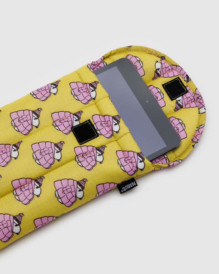 yellow 8 inch puffy tablet sleeve with snoopy wearing a pink puffer coat and hat with tablet sticking out