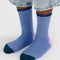 model wearing cornflower ribbed socks with navy and pink trim