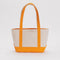 tan small boat tote with tangerine accents