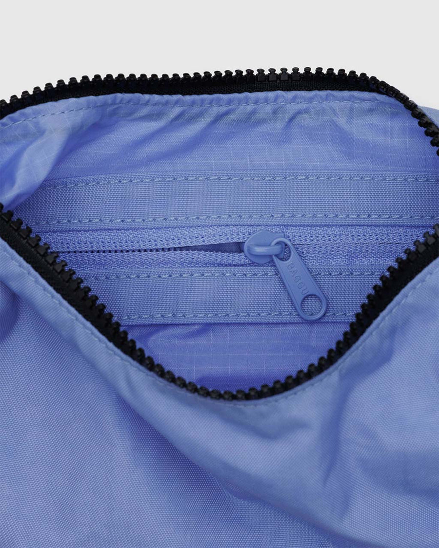 interior zipper pocket of cornflower small nylon crescent bag