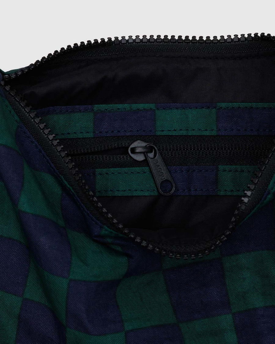 interior pocket of navy and dark green small nylon crescent bag