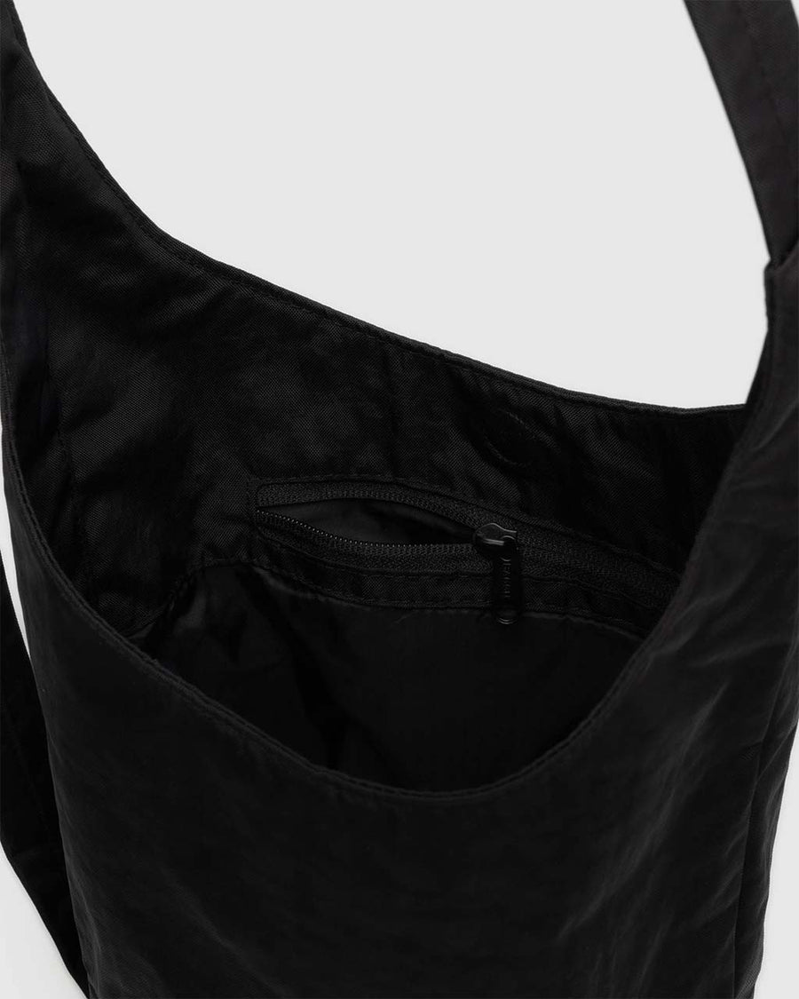 zipper pocket of black small nylon sling bag