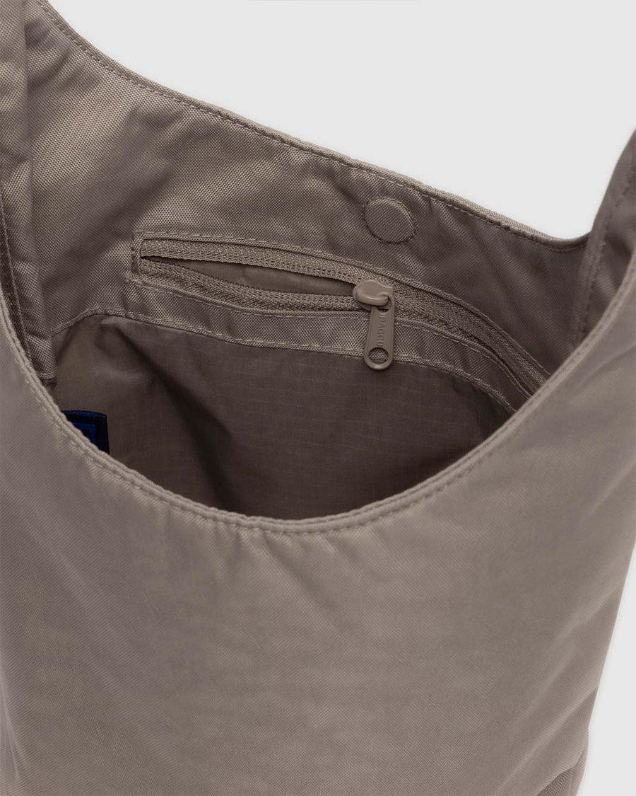 interior pocket of dove small nylon sling bag