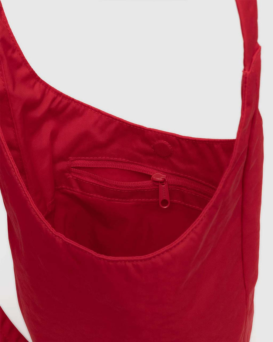 interior pocket of candy apple small nylon sling bag