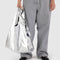 model holding metallic silver standard baggu