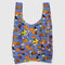 blue standard baggu with peanuts characters in halloween costumes and surrounded by jack o'lanterns and pumpkin