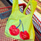 yellow standard baggu with red cherries and 'you're the cherry best' across the front in a grocery cart