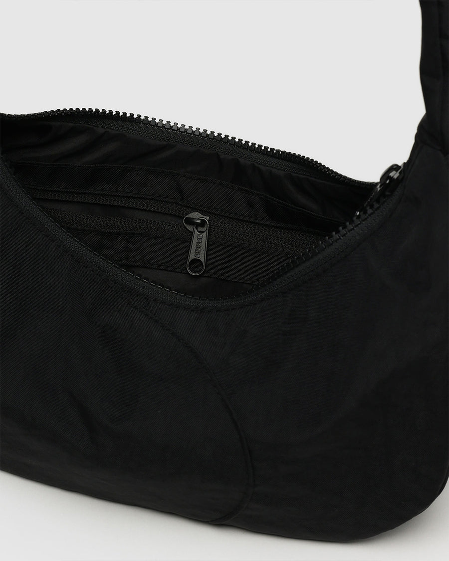 inside zipper of black swan shoulder bag