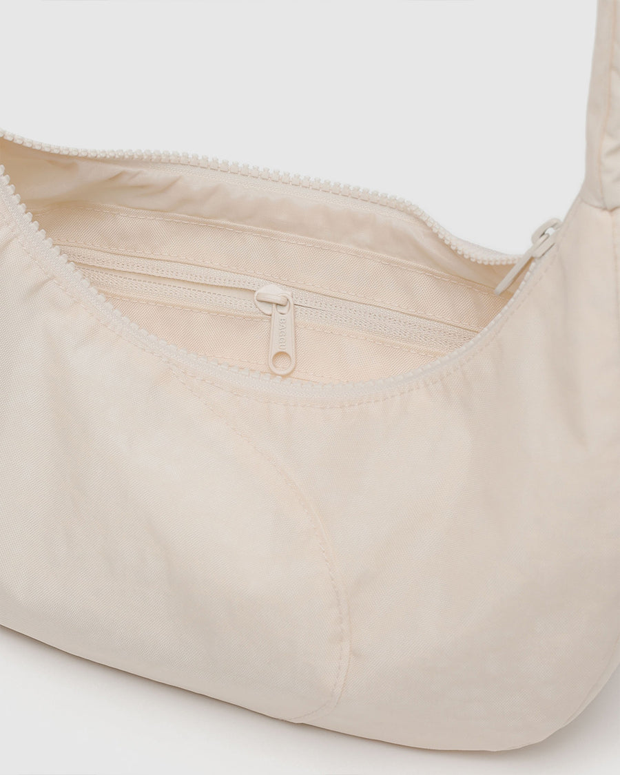 inside zipper of white swan shoulder bag