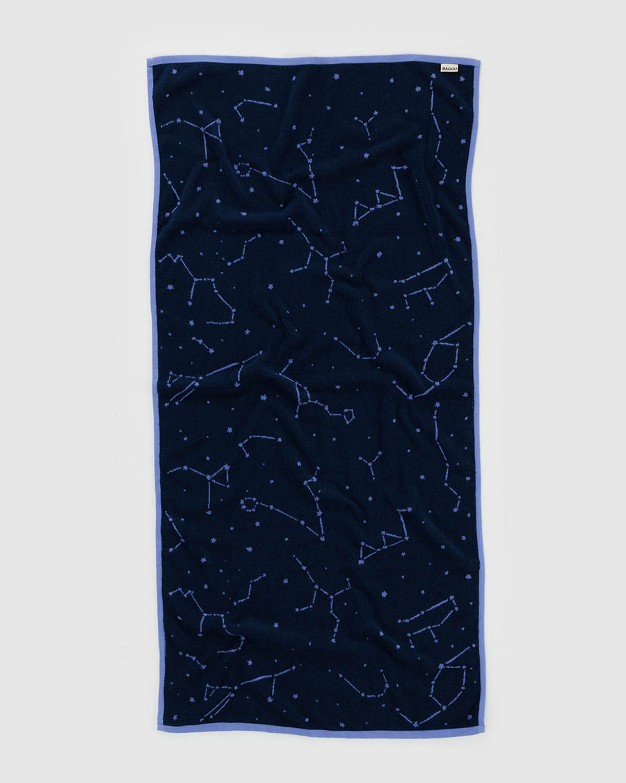 reversible bath towel with navy constellation side showing