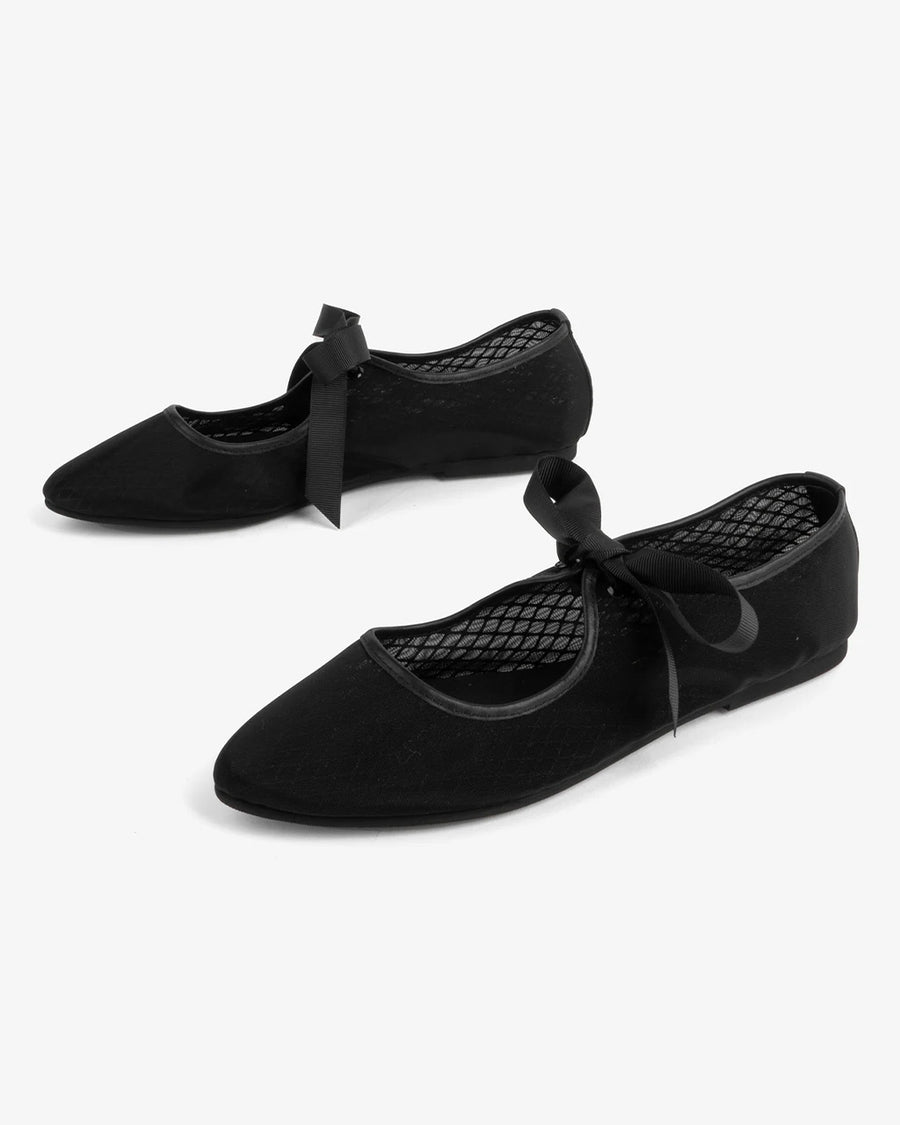 side view of black mesh ballet flats with tie strap