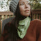 model wearing green square bandana with fiddling frog print