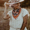 model wearing pink and orange square bandana with bird and floral print