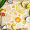 square cotton bandana with abstract banana, orange, papaya print